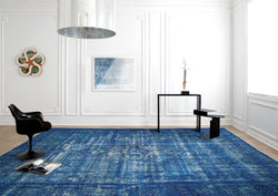 Collection of In front of a white wall, a large blue handwoven rug sets the scene for a modern yet elegant space.  in a gallery layout