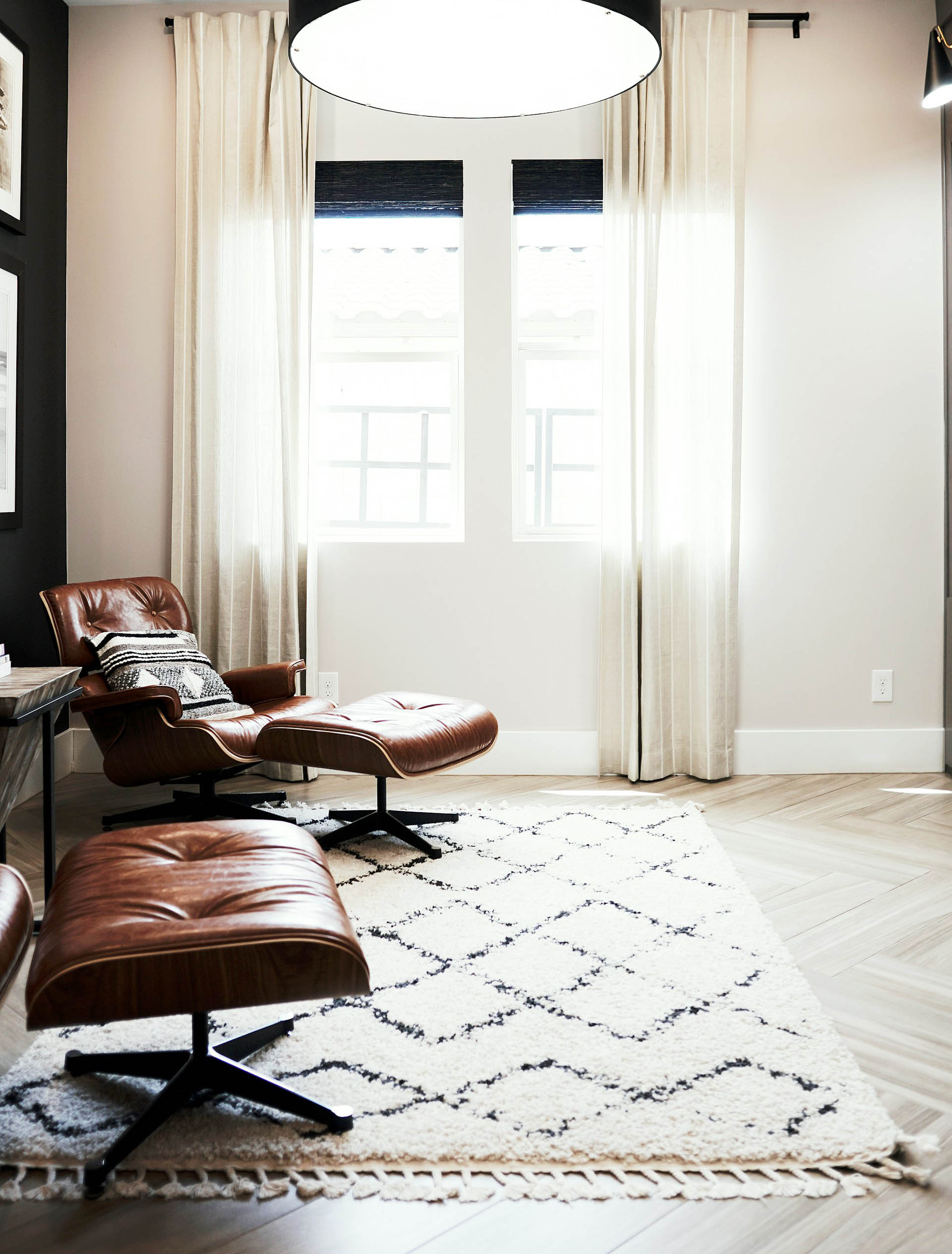 Collection of A stylish, modern room featuring a set of 6x9 rugs in white and black, arranged thoughtfully to showcase their versatility. The room is furnished with sophistic in a gallery layout