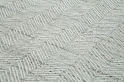 Collection of 9' 10'' x 13' 9'' Grey Moroccan Rug in a gallery layout