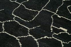 Collection of 6' 5'' x 9' 9'' Black Color Moroccan Rug in a gallery layout