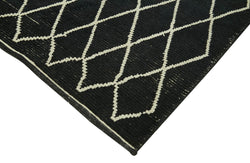 Collection of 5' 5'' x 7' 9'' Black Color Moroccan Rug in a gallery layout