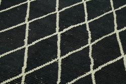 Collection of 5' 5'' x 7' 9'' Black Color Moroccan Rug in a gallery layout