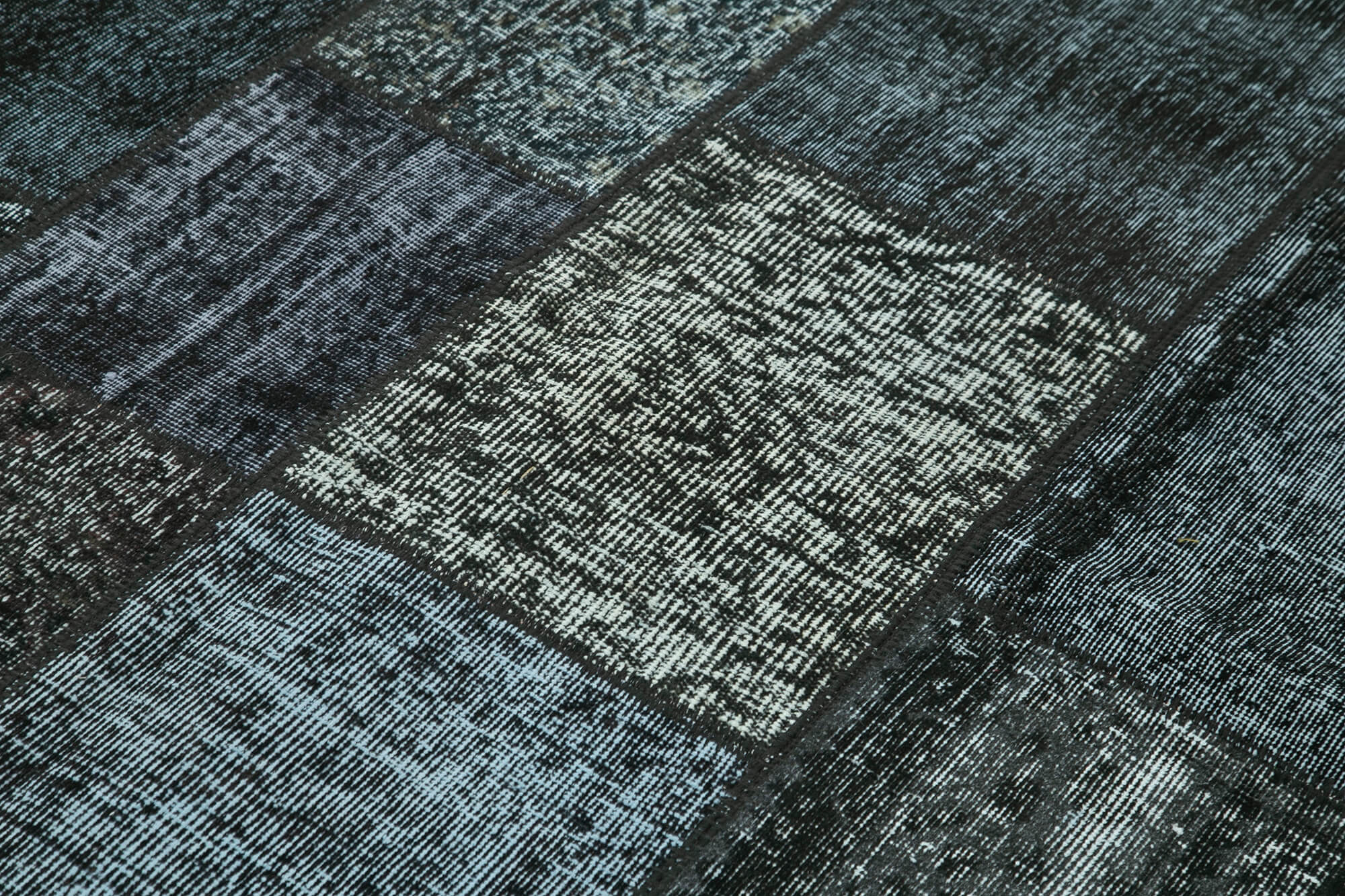 Collection of 5' 7'' x 7' 10'' Hand-Knotted Turkish Patchwork Rug in a gallery layout