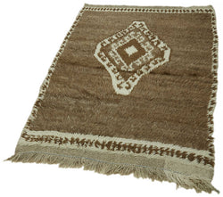 Collection of 3' 5'' x 5' 5'' Vintage Tulu Rug in a gallery layout