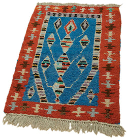 Collection of 2' 2'' x 3' 5'' Vintage Tulu Rug in a gallery layout