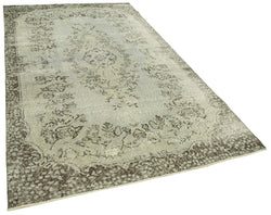 Collection of 5' 6'' x 9' 4'' Handmade Vintage Overdyed Rug in a gallery layout