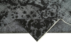 Collection of 5' 8'' x 8' 10'' Over-dyed Turkish Black Rug in a gallery layout