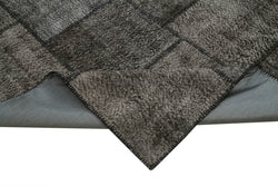 Collection of 9' 11'' x 13' 2'' Black Patchwork Rug in a gallery layout