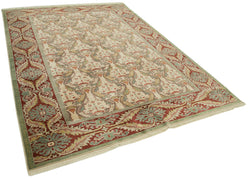 Collection of 6' 6'' x 9' 1'' Hand-Knotted Oushak Rug in a gallery layout