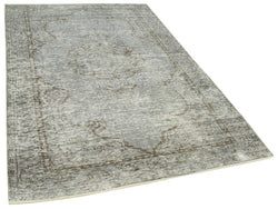 Collection of 5' 2'' x 8' 2'' Handmade Vintage Overdyed Rug in a gallery layout