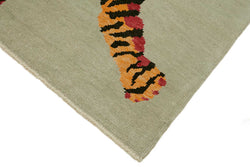 Collection of 5' 6'' x 7' 7'' Handmade Tiger Rug in a gallery layout