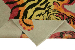 Collection of 5' 6'' x 7' 7'' Handmade Tiger Rug in a gallery layout