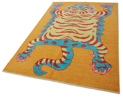 Collection of 5' 1'' x 8' 1'' Handmade Tiger Rug in a gallery layout